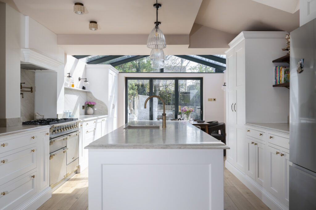 Open brass and stone kitchen